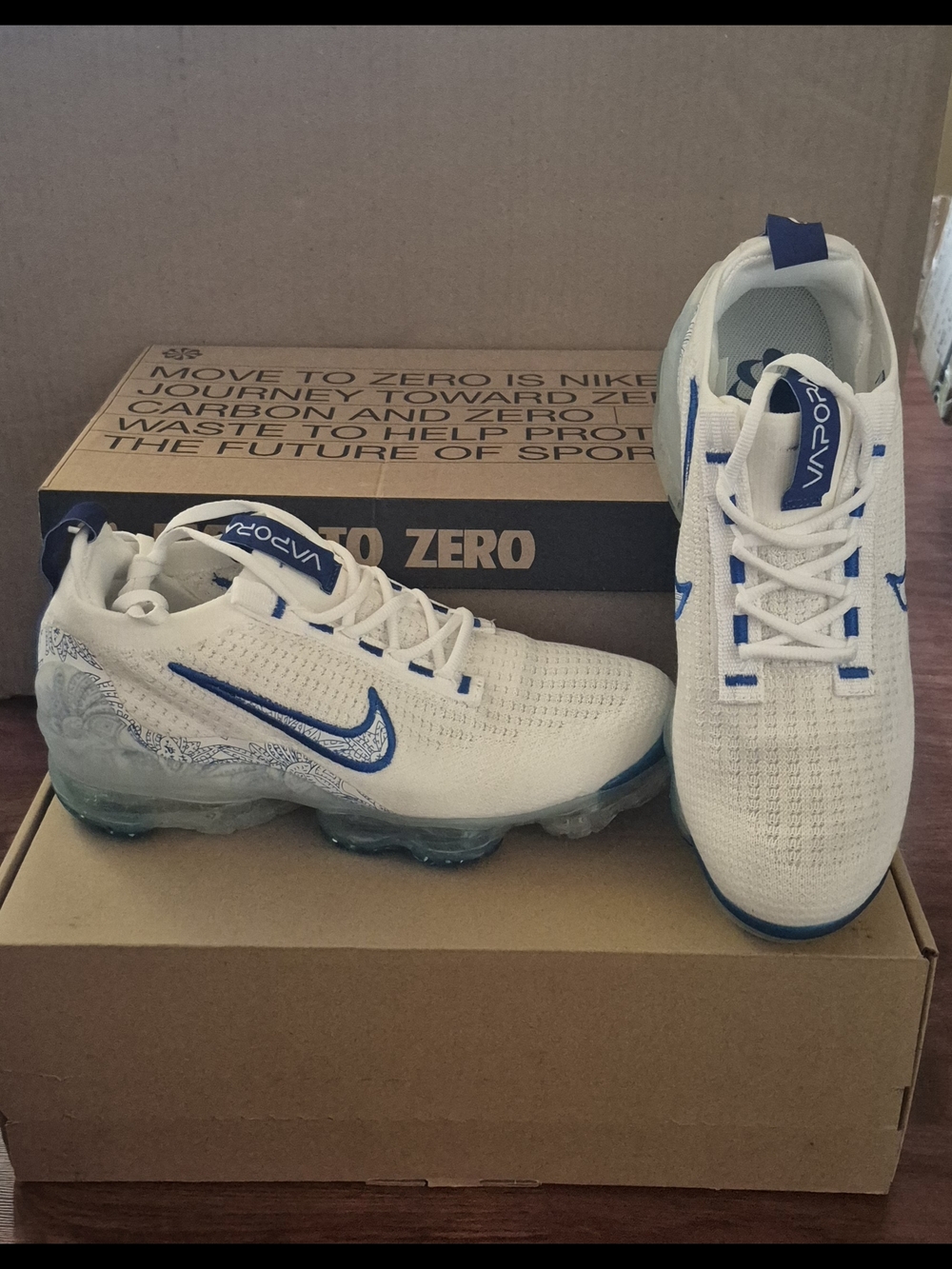 Nike VaporMax Women’s Athletic Shoes - White and Blue.